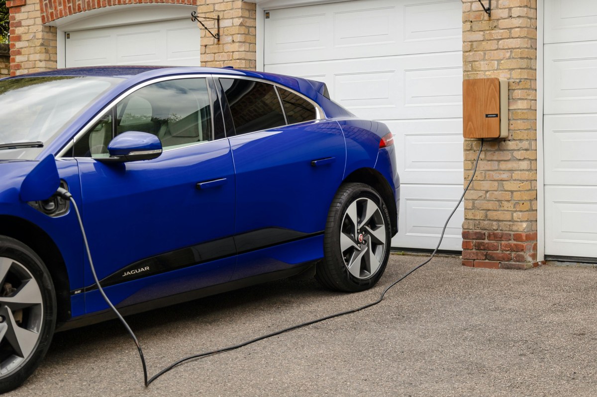 Home electric car charger installed on a driveway